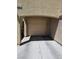 Attached single-car garage with neutral door, offering convenient parking and extra storage space for the home at 7461 Enviable Ct, Las Vegas, NV 89149