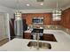 Bright kitchen with stainless steel appliances and a breakfast bar with modern pendant lighting at 7461 Enviable Ct, Las Vegas, NV 89149