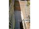 Back patio features concrete pavers, framed by brick walls and metal railings at 7461 Enviable Ct, Las Vegas, NV 89149