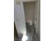 The powder room showcases a toilet and elegant marble flooring, viewed from the staircase at 7461 Enviable Ct, Las Vegas, NV 89149