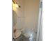 This powder room features a pedestal sink, toilet, and a framed round mirror at 7461 Enviable Ct, Las Vegas, NV 89149