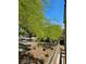 Street view with lush green trees and desert landscaping in a quiet neighborhood at 7461 Enviable Ct, Las Vegas, NV 89149