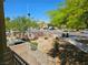 Inviting outdoor view from balcony, showcasing the mature landscaping and neighborhood street at 7461 Enviable Ct, Las Vegas, NV 89149