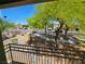 Balcony view showcasing the landscaped yard, nearby streets and neighborhood at 7461 Enviable Ct, Las Vegas, NV 89149