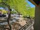 Scenic view from the balcony showcasing landscaped yard, sidewalks, and neighborhood street at 7461 Enviable Ct, Las Vegas, NV 89149