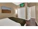 Comfortable bedroom featuring hardwood floor, neutral paint, and built-in closet at 7492 Midfield Ct, Las Vegas, NV 89120