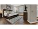 Well-lit bedroom featuring a large bed, modern decor, and shuttered windows at 7492 Midfield Ct, Las Vegas, NV 89120