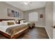Bedroom with two beds, hardwood floors, natural light and neutral paint at 7492 Midfield Ct, Las Vegas, NV 89120