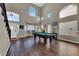 Bright and open game room with a pool table and lots of windows at 7492 Midfield Ct, Las Vegas, NV 89120