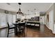 Eat-in kitchen featuring a central island, a gas cooktop, and a dining table at 7492 Midfield Ct, Las Vegas, NV 89120