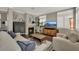 Inviting living room featuring a fireplace, hardwood floors, and modern decor at 7492 Midfield Ct, Las Vegas, NV 89120