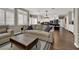 Comfortable living room showcasing neutral furniture, hardwood flooring, and plenty of natural light at 7492 Midfield Ct, Las Vegas, NV 89120