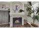 Stylish living room with a cozy fireplace and modern decor accents at 7492 Midfield Ct, Las Vegas, NV 89120