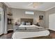 Cozy main bedroom with bedside lamps, floating shelves, and decorative window for natural light at 7492 Midfield Ct, Las Vegas, NV 89120