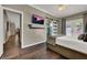 Beautiful main bedroom features a sliding glass door to backyard and ensuite access at 7492 Midfield Ct, Las Vegas, NV 89120
