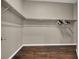 Empty walk-in closet with shelving and a rod for clothes storage at 7492 Midfield Ct, Las Vegas, NV 89120