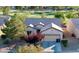 Charming single-story home featuring a two-car garage and picturesque landscaping near the golf course at 7509 Chaffinch St, North Las Vegas, NV 89084