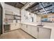 Modern bar featuring sleek countertops, wine storage, and a sink, perfect for entertaining guests at 778 Dainty Daffodil St, Henderson, NV 89011