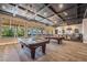 Community clubhouse with two pool tables, coffered ceiling, and natural light at 778 Dainty Daffodil St, Henderson, NV 89011
