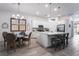 Elegant kitchen with a center island, stainless appliances, and a dining area nearby at 778 Dainty Daffodil St, Henderson, NV 89011