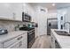 Modern kitchen with marble countertops, stainless steel appliances, and ample cabinet space at 778 Dainty Daffodil St, Henderson, NV 89011