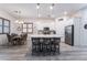 Bright kitchen with stainless steel appliances, center island, and adjacent dining area at 778 Dainty Daffodil St, Henderson, NV 89011