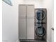 Convenient laundry area with modern washer/dryer units and cabinet storage at 778 Dainty Daffodil St, Henderson, NV 89011