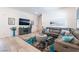 Cozy living room featuring a comfortable couch and stylish decor at 778 Dainty Daffodil St, Henderson, NV 89011
