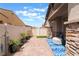 Inviting outdoor patio featuring brick pavers, stucco walls, and a seating area at 778 Dainty Daffodil St, Henderson, NV 89011