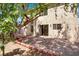 Large backyard featuring a brick patio and a beautiful mature shade tree at 7909 Citrus Meadow Ct, Las Vegas, NV 89131