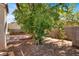 Private backyard with a brick patio, rock landscaping, and mature trees at 7909 Citrus Meadow Ct, Las Vegas, NV 89131