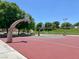 Outdoor basketball court with hoops, situated in a park-like setting with green spaces, offering a recreational area at 7909 Citrus Meadow Ct, Las Vegas, NV 89131