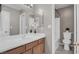 Bathroom featuring wood vanity, white countertop, and shower-tub combo at 7909 Citrus Meadow Ct, Las Vegas, NV 89131