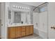 Bathroom features a double sink vanity with a shower and tub combo at 7909 Citrus Meadow Ct, Las Vegas, NV 89131