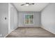 Empty bedroom with neutral carpet, walls, and a bright window view at 7909 Citrus Meadow Ct, Las Vegas, NV 89131