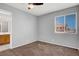 Well-lit bedroom with carpet, a large window, and neutral wall color at 7909 Citrus Meadow Ct, Las Vegas, NV 89131