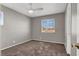 Bright bedroom with a ceiling fan and a window overlooking neighborhood at 7909 Citrus Meadow Ct, Las Vegas, NV 89131