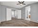 Spacious bedroom with carpeted floors, ceiling fan, and ample closet space at 7909 Citrus Meadow Ct, Las Vegas, NV 89131