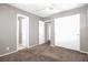 Bedroom with carpet, ceiling fan, and several closets for ample storage at 7909 Citrus Meadow Ct, Las Vegas, NV 89131