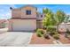 Charming two-story home featuring a red-tiled roof and a well-maintained front yard with low-lying shrubs and trees at 7909 Citrus Meadow Ct, Las Vegas, NV 89131