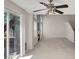 Bright and airy living room featuring a fireplace, tile flooring, and sliding glass doors leading to the backyard at 7909 Citrus Meadow Ct, Las Vegas, NV 89131