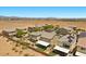Daytime aerial view of a home featuring a private backyard, covered patio, and desert landscaping at 8013 Green River Knob St, Las Vegas, NV 89113