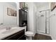 Bathroom featuring a stand-up shower, modern finishes and ample cabinet space at 8013 Green River Knob St, Las Vegas, NV 89113