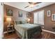 Comfortable bedroom with a ceiling fan, and neutral decor at 8013 Green River Knob St, Las Vegas, NV 89113