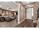 Inviting home entryway with hardwood floors and comfortable living room at 8013 Green River Knob St, Las Vegas, NV 89113