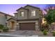 Two-story home with a two-car garage and low-maintenance landscaping at 8013 Green River Knob St, Las Vegas, NV 89113