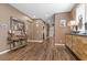 Bright hallway with hardwood floors and art display at 8013 Green River Knob St, Las Vegas, NV 89113