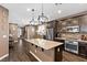 Stylish kitchen with a large center island and modern stainless steel appliances at 8013 Green River Knob St, Las Vegas, NV 89113