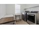 Functional laundry room with stainless steel appliances and ample counter space at 8013 Green River Knob St, Las Vegas, NV 89113