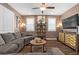 The expansive living room features a stylish entertainment center and natural light at 8013 Green River Knob St, Las Vegas, NV 89113